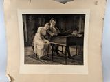 an old photo of a woman sitting at a desk with a dog
