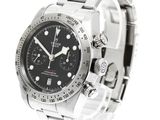 rolex watch with black dial and stainless steel bracelet on a white background