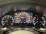 a close up of a car dashboard with various gauges