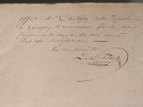 an old document with writing on it on a table