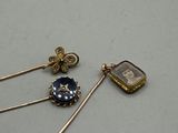 two pairs of gold - plated earrings with blue and white stones