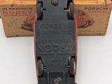 a small toy car that is sitting in front of a box
