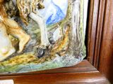 a figurine of a man and a horse on a shelf