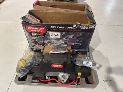 a box of tools on a pallet in a store
