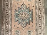 an old rug with fringes and fringes on the ground