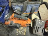 a bag of tools and a tool bag sitting on the floor