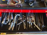 many tools in a tool box on a table