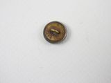an image of a small button on a white surface