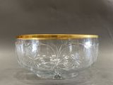 an image of a glass bowl with gold rim sitting on a table