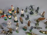 many figurines of different types and sizes on the table