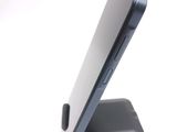 a close up of a cell phone on a stand