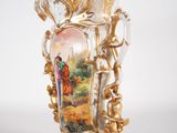 a vase with a picture of a man and a woman on it