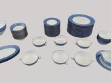 many plates and bowls arranged together on the table