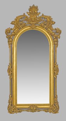 an ornate gold framed mirror with an ornate design