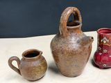 three vases sitting on a table next to each other
