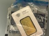 a gold bar in a plastic bag on a table