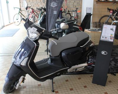 a scooter that is parked inside of a building