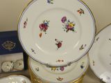 a lot of plates and bowls sitting on a table