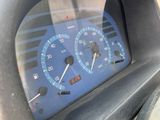a close up of a car dashboard with a speedometer