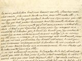 un gros plan d'un morceau de papier sur lequel on a écrit
