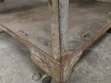 a metal cart that is sitting in a garage