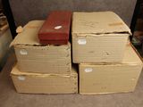 many boxes stacked on top of each other on the floor