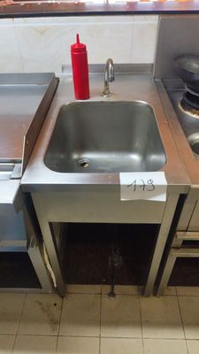 a kitchen with a sink and a stove in it