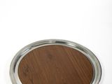 a wooden table with a metal tray on it