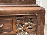 a small wooden table with a drawer on top of it