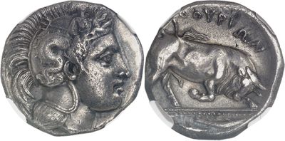an ancient silver coin with a head of a bull and a head of a horse
