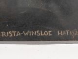 an image of a close up of a plaque on a white surface
