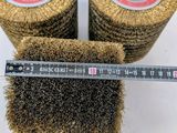 a close up of three rolls of wire and a ruler
