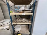 a small refrigerator and some shelves in a room