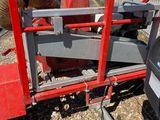 an image of a red trailer with a hose attached to it
