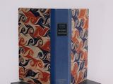 the book is sitting on top of the book stand