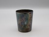 a cup that is sitting on a white surface