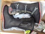 a box with a pair of gloves and a pair of gloves in it