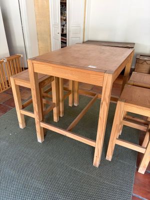 a small table and two chairs in a room