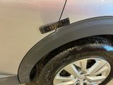 a close up of a car ' s tire with a sticker on it