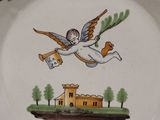 a plate with a picture of a flying bird on it