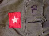 a patch on the back of a jacket with a star on it