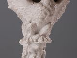 a statue of an eagle on a pedestal with a bird on it