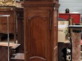 a grandfather clock sitting in the middle of a room