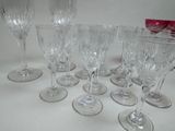 several empty wine glasses sitting on a table with a red box in the background