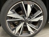a close up of a car wheel with a sticker on it