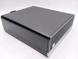 an image of a small black computer on a white surface