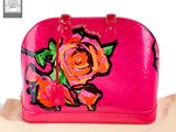pink louis vuitton handbag with a rose design on it