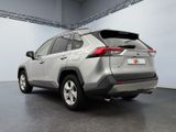 the rear end of a silver toyota rav parked in a garage