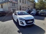 a white car that is parked in front of a building