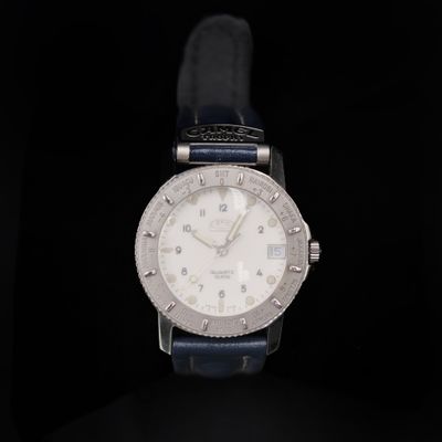 a close up of a watch on a black background